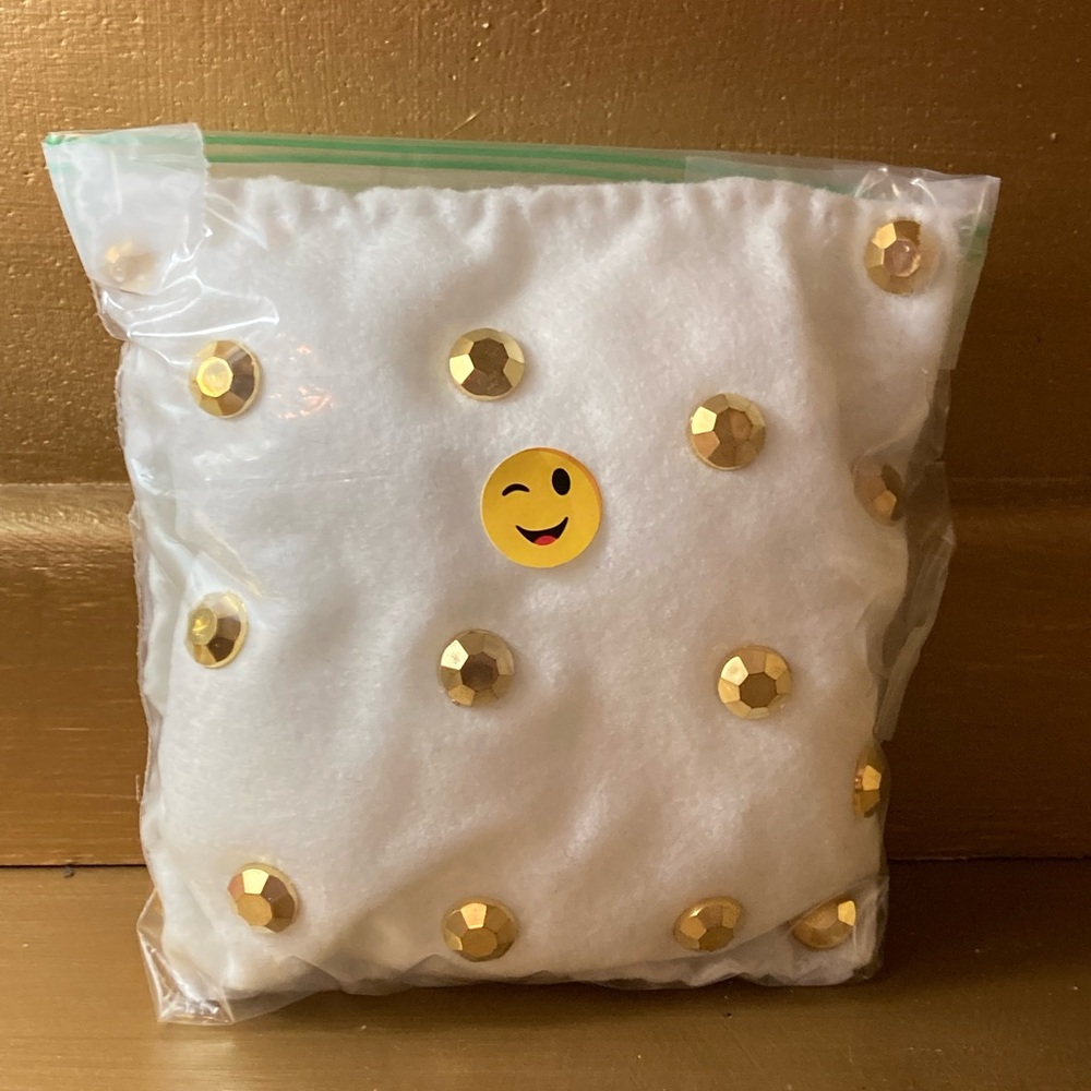 A white rhinestone pillow
